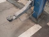 a close up of a blue pole on the street