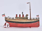 une maquette rouge et noire d'un bateau dans la neige