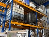 a large amount of pallets stacked on a rack in a warehouse