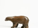 wooden sculpture of a polar bear on a white background