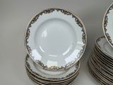 many plates stacked on top of each other on a table