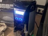 a blender that is sitting on a table next to a coffee maker