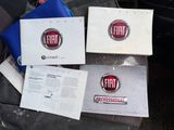 three fiat logos are sitting on top of a piece of paper