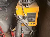 a small machine that is sitting in the corner of a room