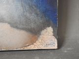 a picture of a painting on a table with a blue sky in the background