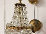a wall light that is hanging on the wall