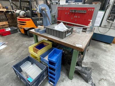 a workbench that has a bunch of boxes on top of it