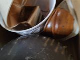 a cup of coffee sitting next to a bowl of doughnuts
