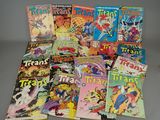 many comics are stacked on top of each other on a table
