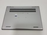 a silver laptop that is sitting on a white table