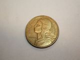 a gold coin with a picture of a woman ' s face on it