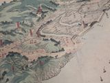 an old map of a town on the water
