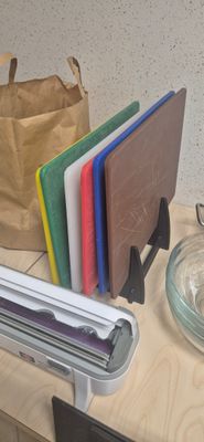 a table with a bunch of books and a glass bowl on it