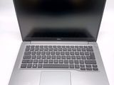 an open laptop computer sitting on top of a white table