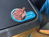 a close up of a piece of luggage with a sticker on it