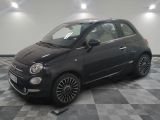 a picture of a small black car parked in a garage