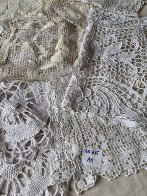 a close up of a table cloth with lace on it