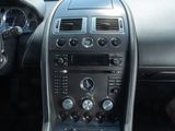 a dashboard of a car with many buttons and controls