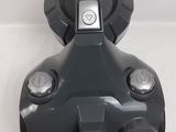 an image of a black vacuum cleaner on a white surface
