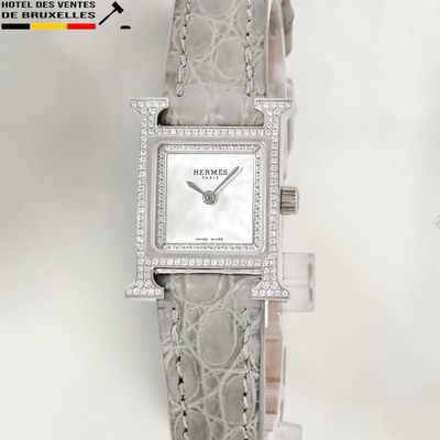 an image of a woman ' s wrist watch with diamonds on it