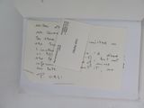 two pieces of paper with writing on them in a white box