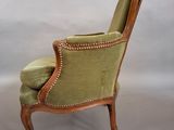 an image of a chair with a green upholstered seat
