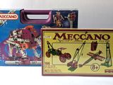 two boxes of meccan toys on a white surface