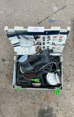 a box with a pair of shoes in it on the ground