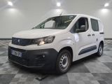 the white van is parked on a checkered floor in a room