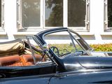 a black car with luggage in the back of it