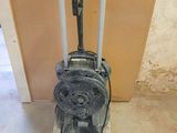 a small machine that is sitting in the corner of a room