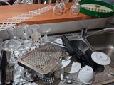 a kitchen counter with a bunch of dishes and utensils