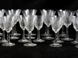 a lot of empty wine glasses on a black table