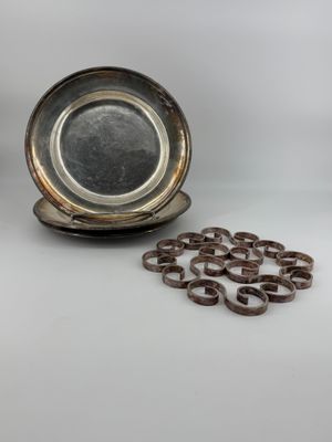 a silver plate with a bunch of rings on it