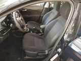 the interior of a car with two seats and a steering wheel