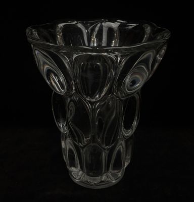 a glass vase that is sitting on a table