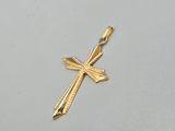 l'image d'une croix en or sur un fond blanc