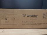 a cardboard box sitting on top of a wooden table