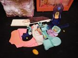 a small doll house with a lot of toys on the floor
