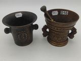a pair of chinese bronze tea cups and saucers