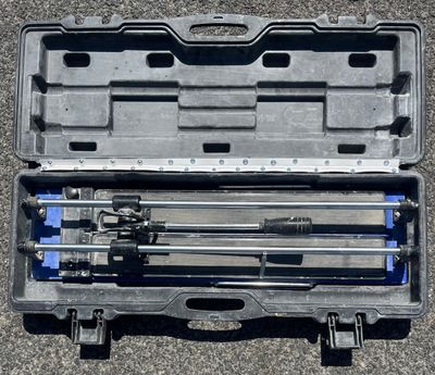 a tool kit in a plastic case on the ground