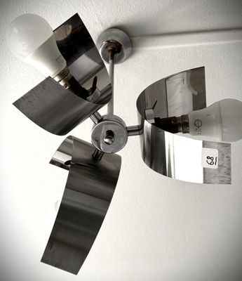 a close up of a ceiling light with two lamps