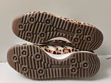 the soles of a pair of shoes are shown on a white surface