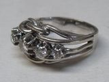 a close up of a ring with flowers on it