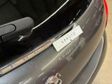 a close up of a car with a sticker on the back of it