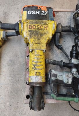 two electric tools that are laying on the floor