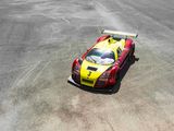 a red and yellow race car that is on a track