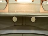 a mirror on the wall above a sink in a bathroom