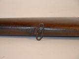 a metal tube with a metal ring on it
