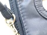 a black purse with a zipper on the inside of it